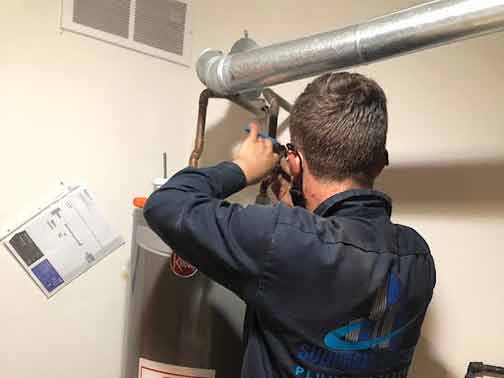 our plumber performing a water heater replacement in hinsdale il.