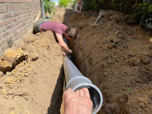 a plumber performing a sewer line replacement.