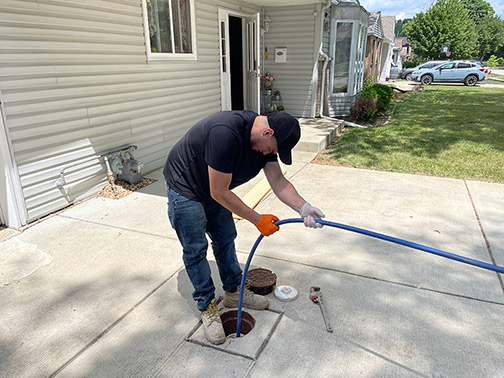 a plumber performing a hydro jetting